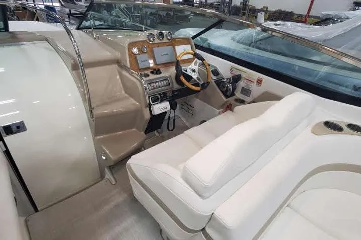  Yacht Photos Pics 2012 Formula 310 Sun Sport boat interior with beige seating and modern dashboard.