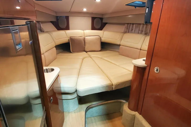  Yacht Photos Pics Luxurious interior of 2012 Formula 310 Sun Sport boat with plush seating and wood accents.