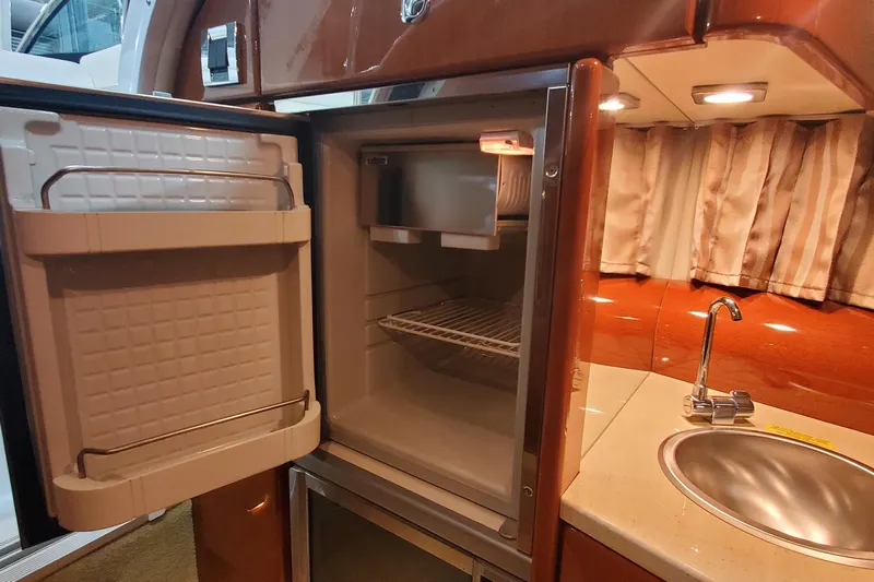  Yacht Photos Pics 2012 Formula 310 Sun Sport interior with open fridge and sink.