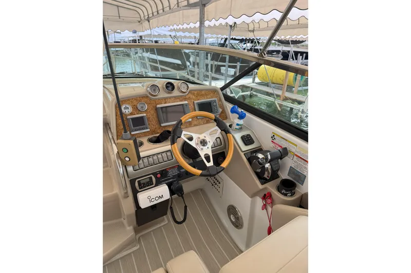  Yacht Photos Pics Cockpit of 2012 Formula 310 Sun Sport boat with steering wheel and control panel.