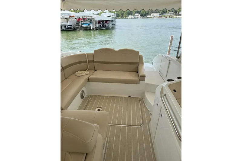  Yacht Photos Pics Interior of 2012 Formula 310 Sun Sport boat with beige seating and lake view.