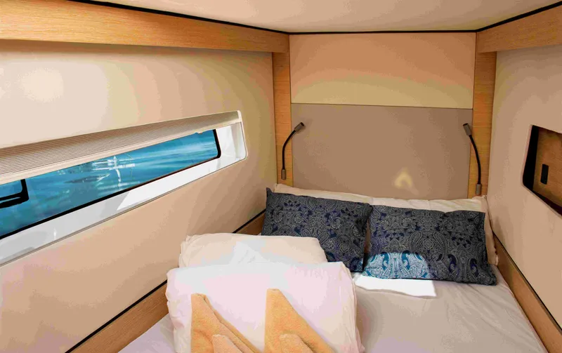 Double Memory Yacht Photos Pics Cozy cabin interior of 2023 Nautitech 44 yacht with bed and window view.