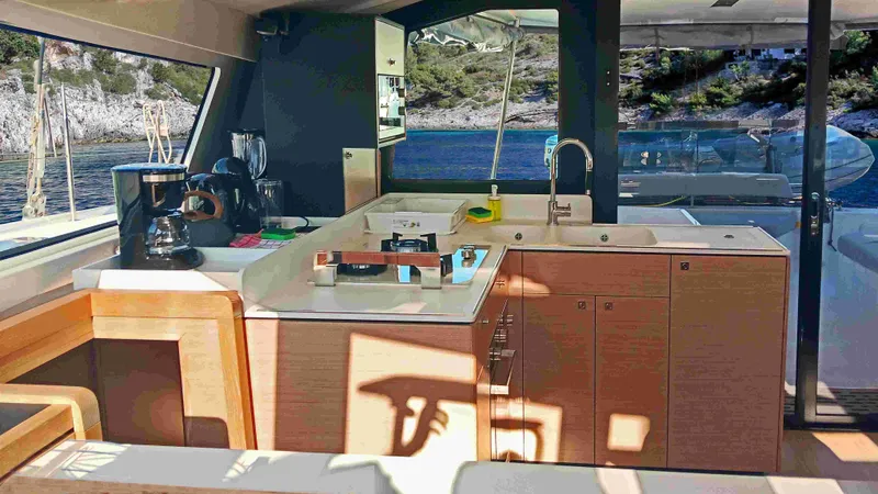 Double Memory Yacht Photos Pics Modern kitchen interior of 2023 Nautitech 44 yacht with scenic ocean view.