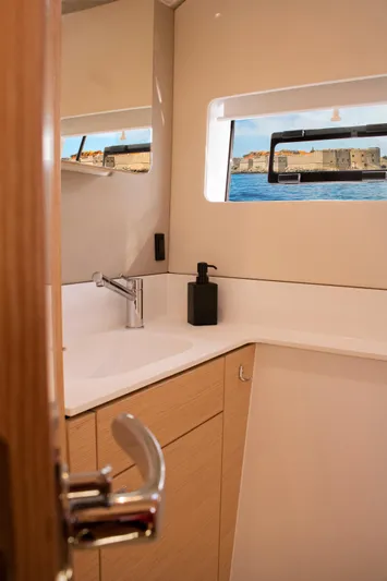Double Memory Yacht Photos Pics Modern bathroom interior on 2023 Nautitech 44 yacht with ocean view window.