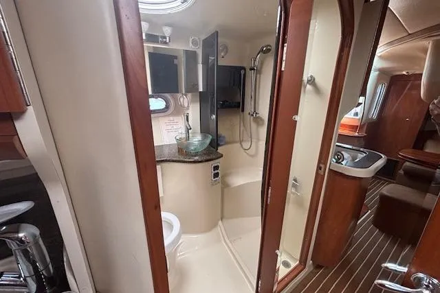  Yacht Photos Pics 2005 Four Winns 378 Vista yacht interior with bathroom and kitchenette.