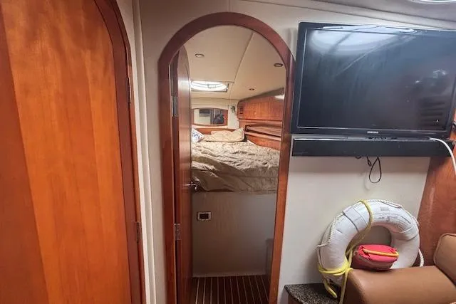  Yacht Photos Pics Interior of 2005 Four Winns 378 Vista yacht with cozy cabin and mounted TV.