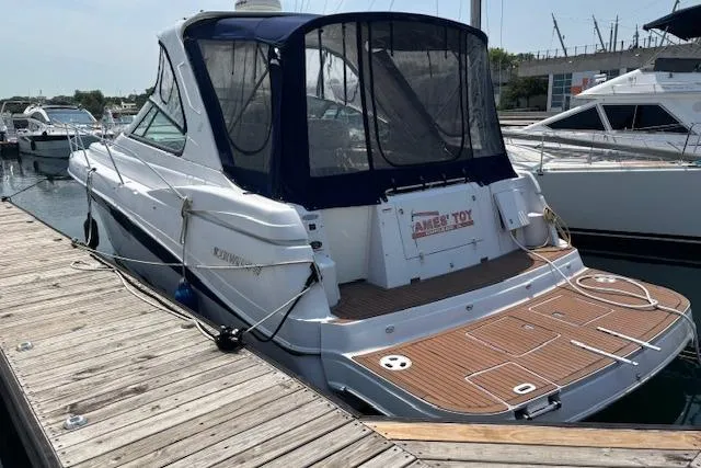  Yacht Photos Pics 2005 Four Winns 378 Vista yacht docked at marina, rear view with covered deck.