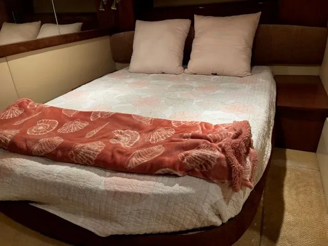 Why Knot Yacht Photos Pics Interior of a 2006 Meridian 411 Sedan yacht with cozy bed.