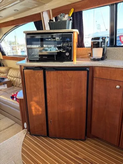 Why Knot Yacht Photos Pics Interior of a 2006 Meridian 411 Sedan yacht, kitchen with microwave and coffee maker.
