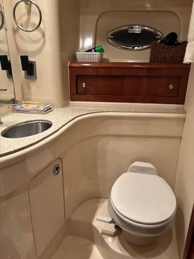 Why Knot Yacht Photos Pics Luxurious bathroom in a 2006 Meridian 411 Sedan yacht.