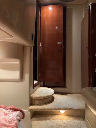 Why Knot Yacht Photos Pics Interior of a 2006 Meridian 411 Sedan yacht with wooden door.