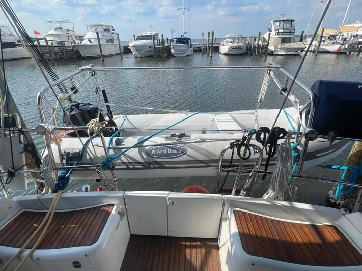 Karisma Yacht Photos Pics Jeanneau Sun Odyssey 45 sailboat, 2006 model, docked at marina with other boats.