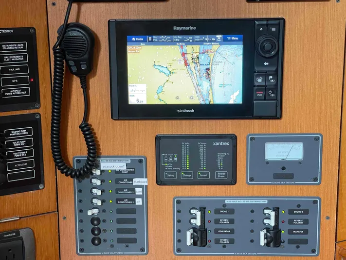 Karisma Yacht Photos Pics Control panel of 2006 Jeanneau Sun Odyssey 45 with navigation and communication equipment.