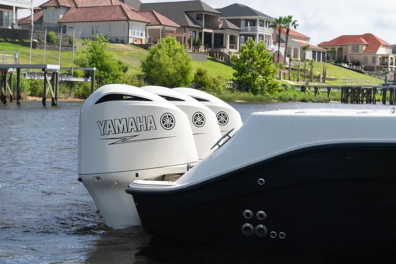  Yacht Photos Pics 2018 HCB 39 Speciale with Yamaha outboard engines on a scenic waterfront.