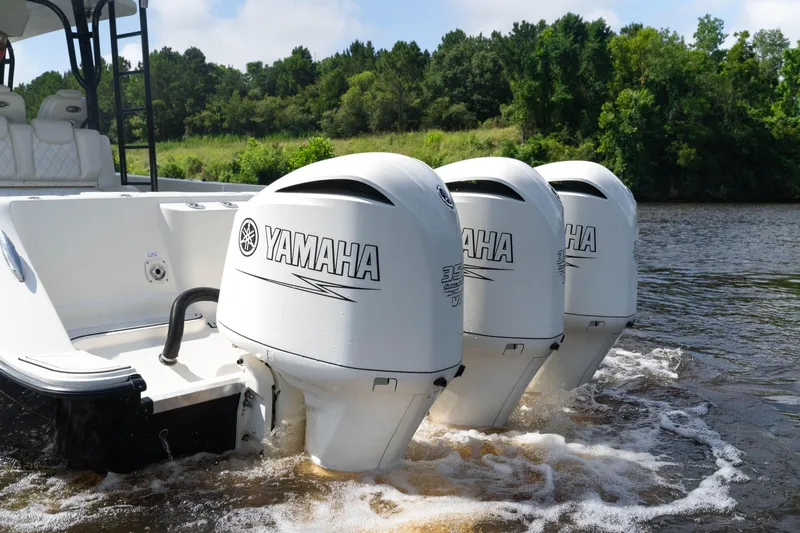  Yacht Photos Pics 2018 HCB 39 Speciale with triple Yamaha outboard engines on a river.