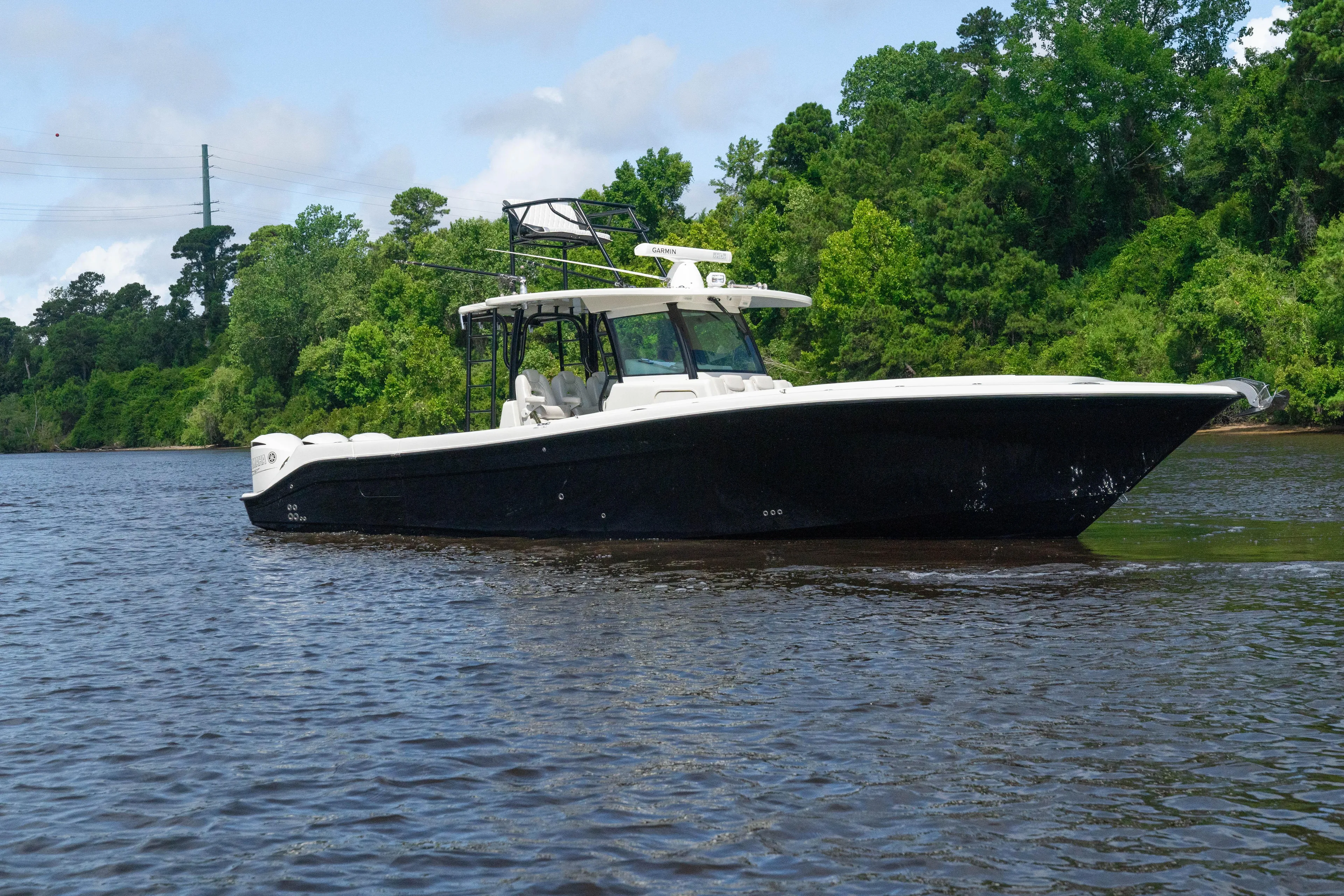 Yacht Photos Pics 2018 HCB 39 Speciale boat cruising on a scenic river.