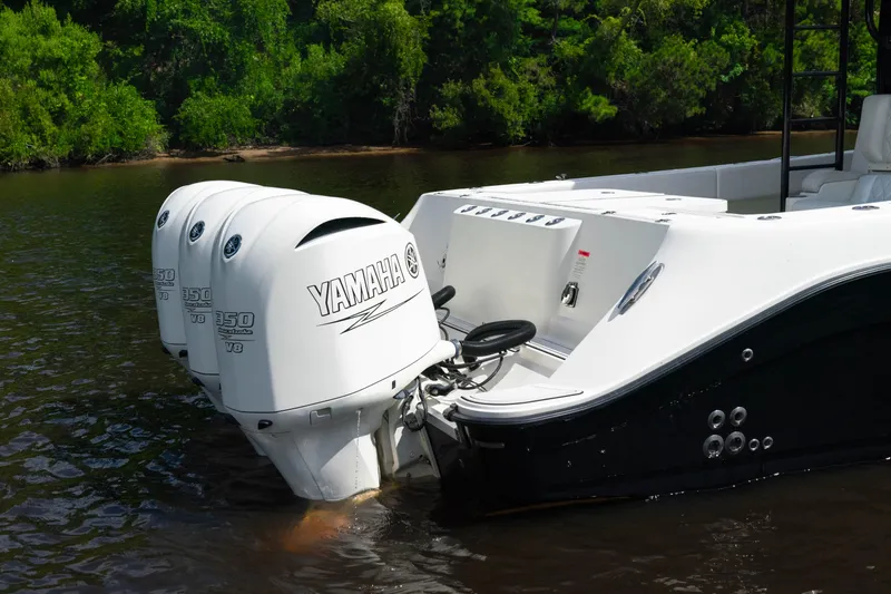  Yacht Photos Pics 2018 HCB 39 Speciale boat with Yamaha outboard engines on a calm river.