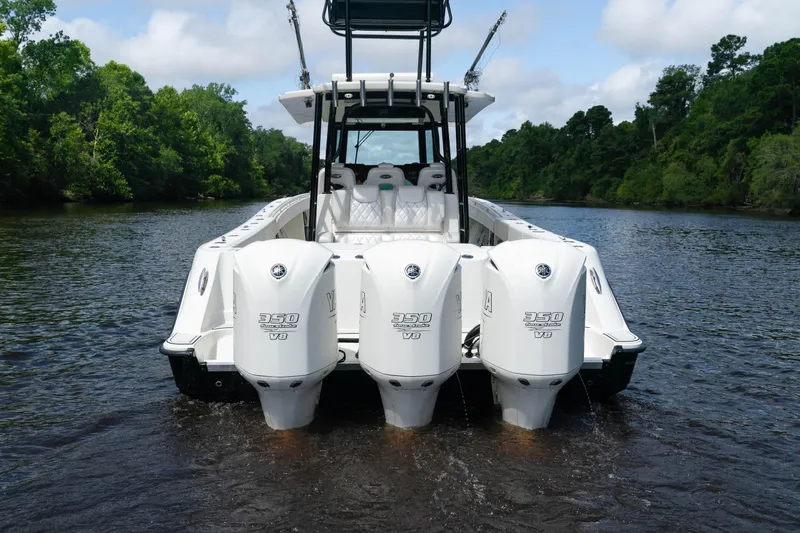  Yacht Photos Pics 2018 HCB 39 Speciale boat with triple outboard engines on a scenic river.