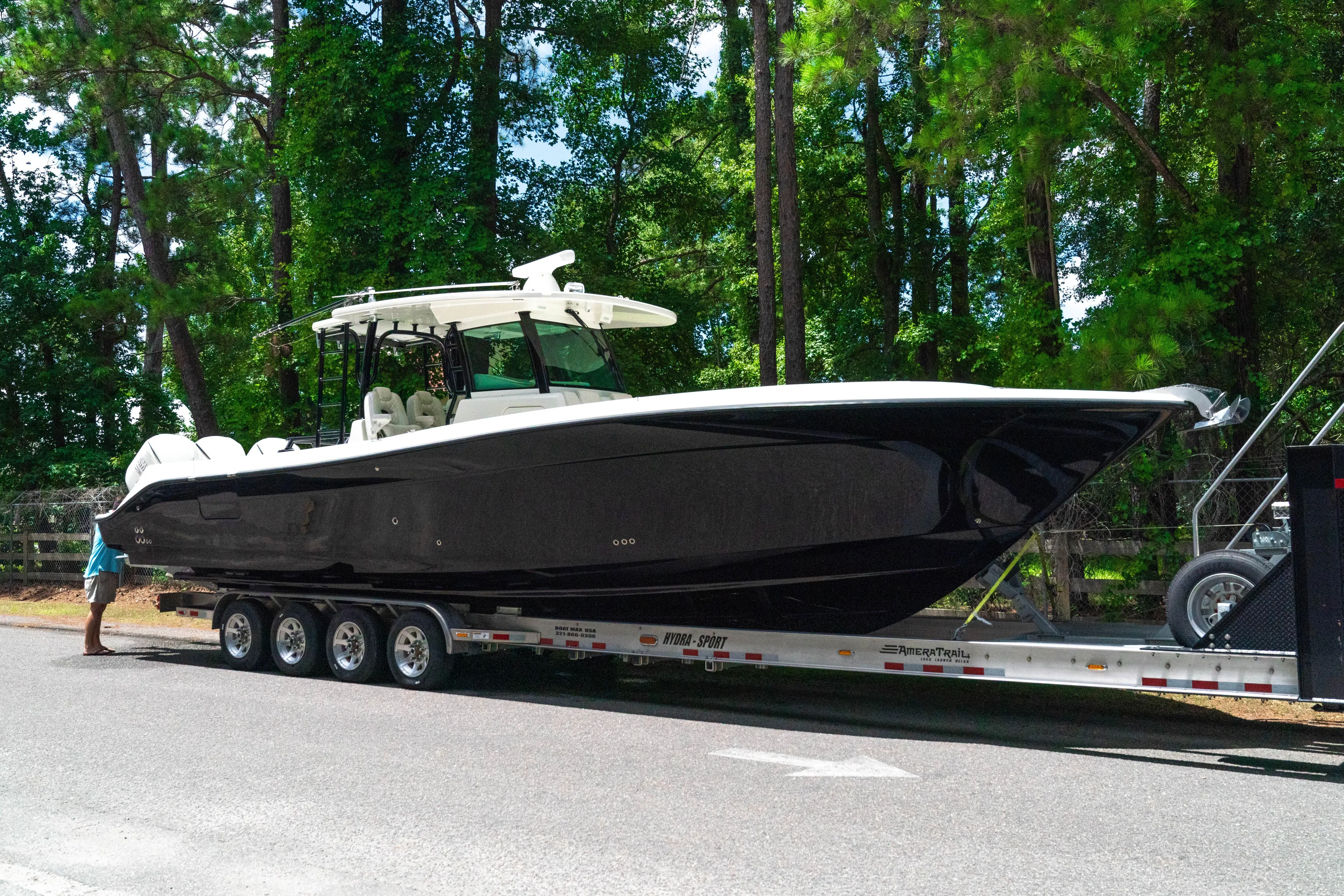 Yacht Photos Pics 2018 HCB 39 Speciale boat on trailer, surrounded by trees.