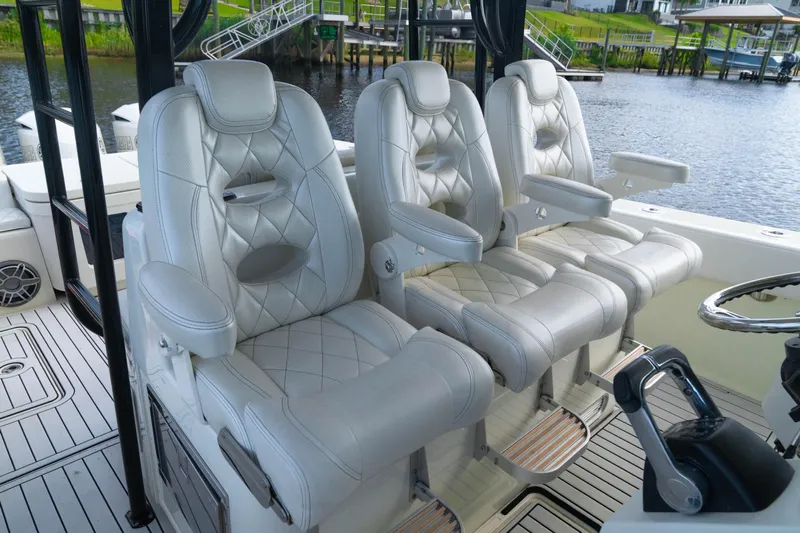  Yacht Photos Pics Luxurious seating on 2018 HCB 39 Speciale boat, featuring elegant white leather upholstery.