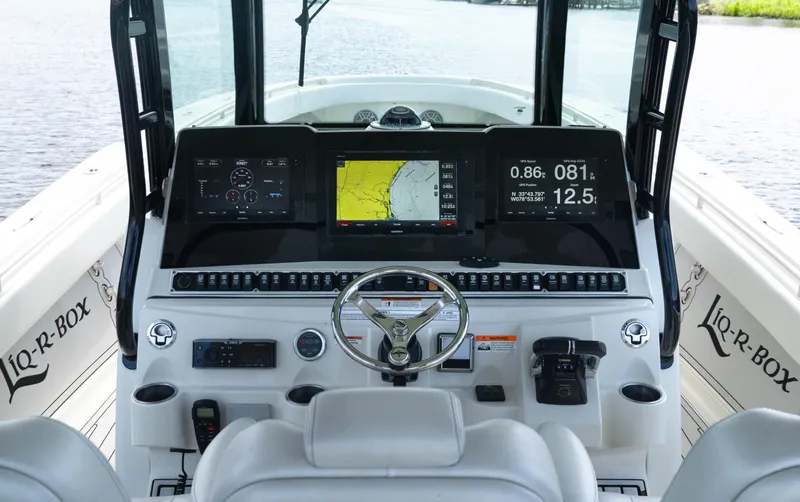  Yacht Photos Pics 2018 HCB 39 Speciale boat dashboard with navigation screens and controls.