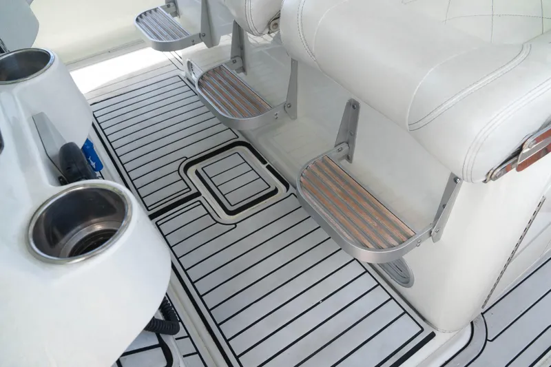  Yacht Photos Pics 2018 HCB 39 Speciale boat interior with white seating and striped flooring.