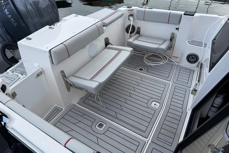  Yacht Photos Pics 2024 Solara S-250 Coupe boat interior with gray seating and deck, featuring Yamaha engine.