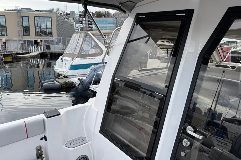  Yacht Photos Pics 2024 Solara S-250 Coupe at marina, showcasing sleek design and modern features.