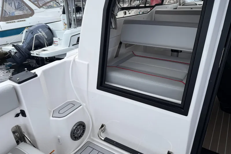  Yacht Photos Pics 2024 Solara S-250 Coupe interior view with seating and boat details.