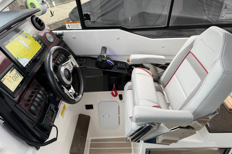  Yacht Photos Pics 2024 Solara S-250 Coupe cockpit with advanced navigation and luxurious seating.