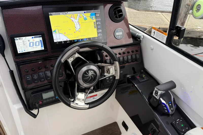  Yacht Photos Pics 2024 Solara S-250 Coupe dashboard with navigation screens and modern controls.