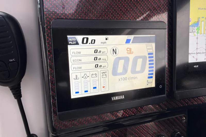  Yacht Photos Pics Yamaha autopilot display in 2024 Solara S-250 Coupe, showing speed and flow metrics.