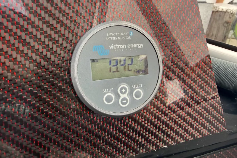  Yacht Photos Pics Victron Energy battery monitor in 2024 Solara S-250 Coupe, displaying 12.2 volts.