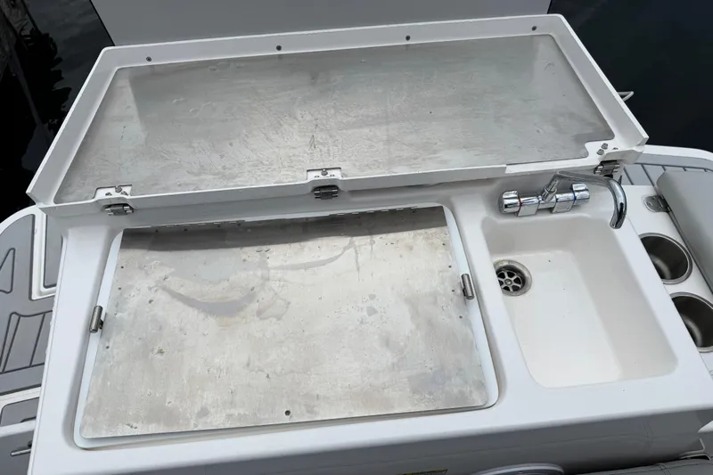  Yacht Photos Pics 2024 Solara S-250 Coupe boat sink and prep station with faucet and storage.