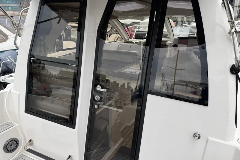  Yacht Photos Pics 2024 Solara S-250 Coupe boat interior with sleek glass doors and modern design.