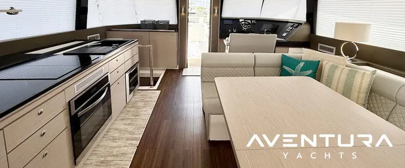  Yacht Photos Pics Luxurious interior of 2025 Aventura 56 Motor Yacht with modern kitchen and seating area.