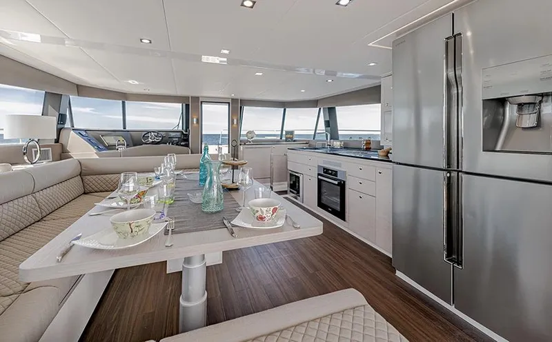  Yacht Photos Pics Luxurious interior of 2025 Aventura 56 Motor Yacht with modern kitchen and dining area.