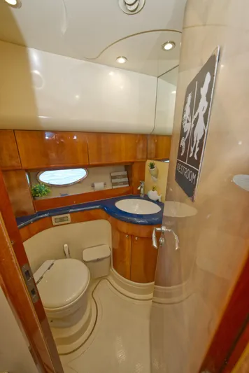 2003 Aicon Yacht 56 Yacht Photos Pics Luxurious bathroom in 2003 Aicon 56 yacht with modern fixtures and wood accents.