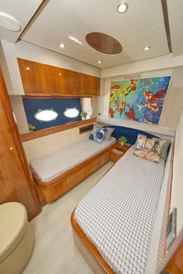 2003 Aicon Yacht 56 Yacht Photos Pics Luxurious 2003 Aicon 56 yacht cabin with twin beds and vibrant wall art.