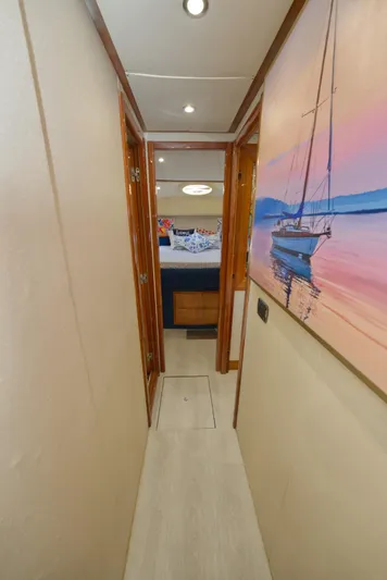 2003 Aicon Yacht 56 Yacht Photos Pics Narrow hallway in 2003 Aicon 56 yacht with sailboat painting.