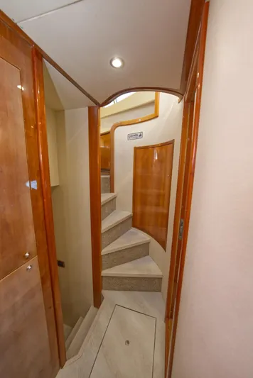 2003 Aicon Yacht 56 Yacht Photos Pics Interior of 2003 Aicon 56 yacht with wooden stairs and elegant design.