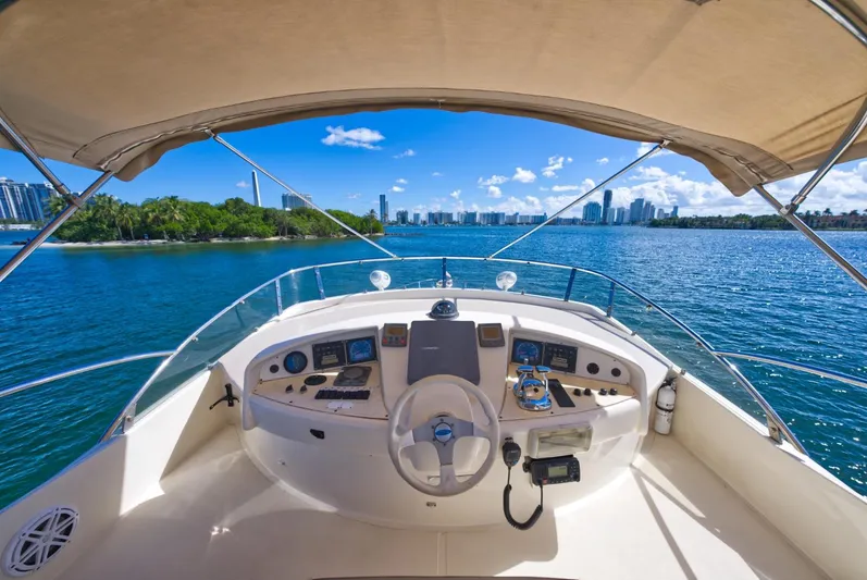 2003 Aicon Yacht 56 Yacht Photos Pics Aicon 56 yacht helm, 2003 model, with city skyline and blue water view.