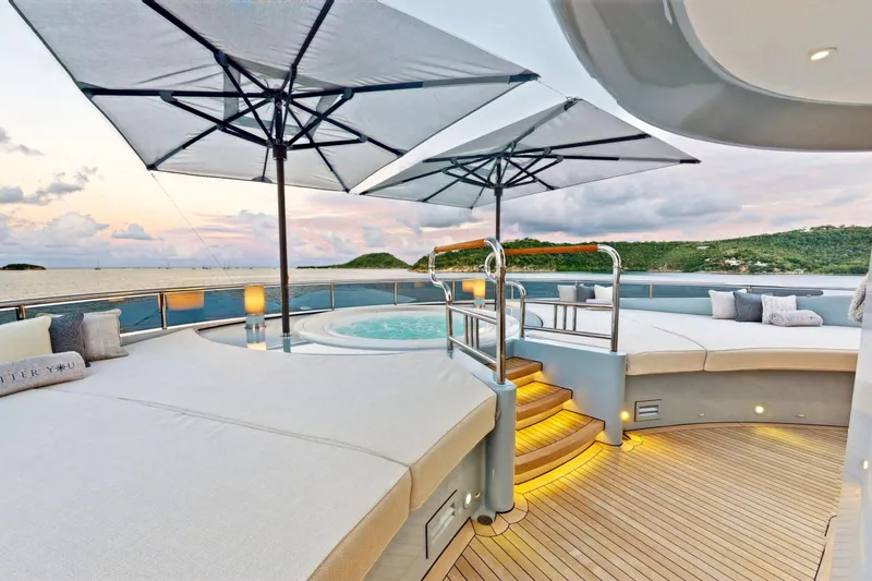 After You Yacht Photos Pics Luxurious Heesen 55m yacht deck with jacuzzi, sun loungers, and umbrellas, 2011 model.