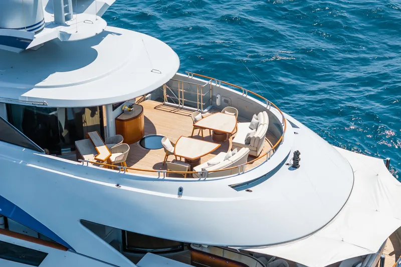 After You Yacht Photos Pics Luxurious Heesen 55m yacht deck with elegant seating, overlooking the ocean, built in 2011.