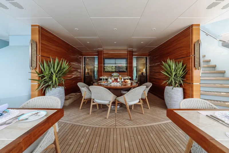 After You Yacht Photos Pics Luxurious dining area on 2011 Heesen 55m yacht with elegant wood paneling and modern decor.