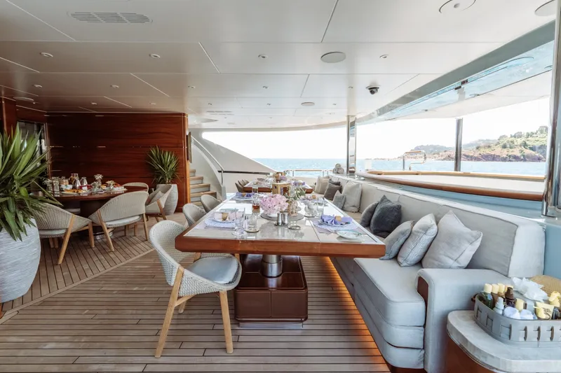 After You Yacht Photos Pics Luxurious dining area on 2011 Heesen 55m yacht with elegant seating and ocean view.