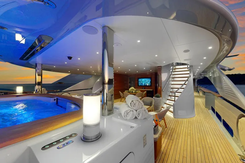 After You Yacht Photos Pics Luxurious Heesen 55m yacht deck with jacuzzi, elegant seating, and sunset view, built in 2011.