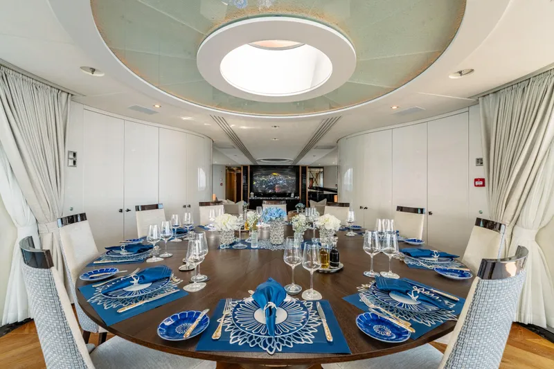 After You Yacht Photos Pics Luxurious dining area on a 2011 Heesen 55m yacht, featuring elegant table settings and modern decor.