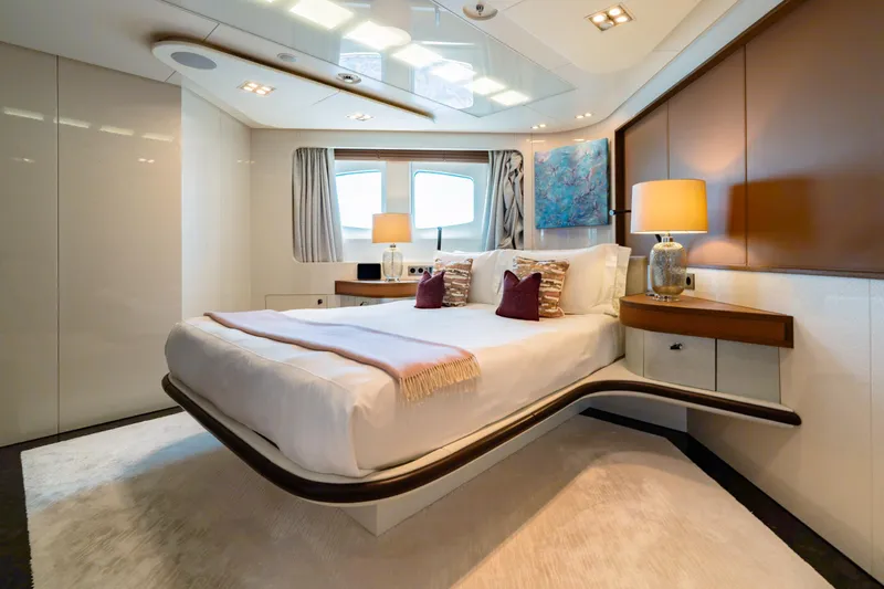 After You Yacht Photos Pics Luxurious bedroom interior on a 2011 Heesen 55m yacht, featuring modern design and elegant decor.