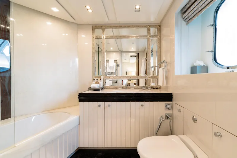 After You Yacht Photos Pics Luxurious yacht bathroom with elegant fixtures, large mirror, and bathtub on a 2011 Heesen 55m.